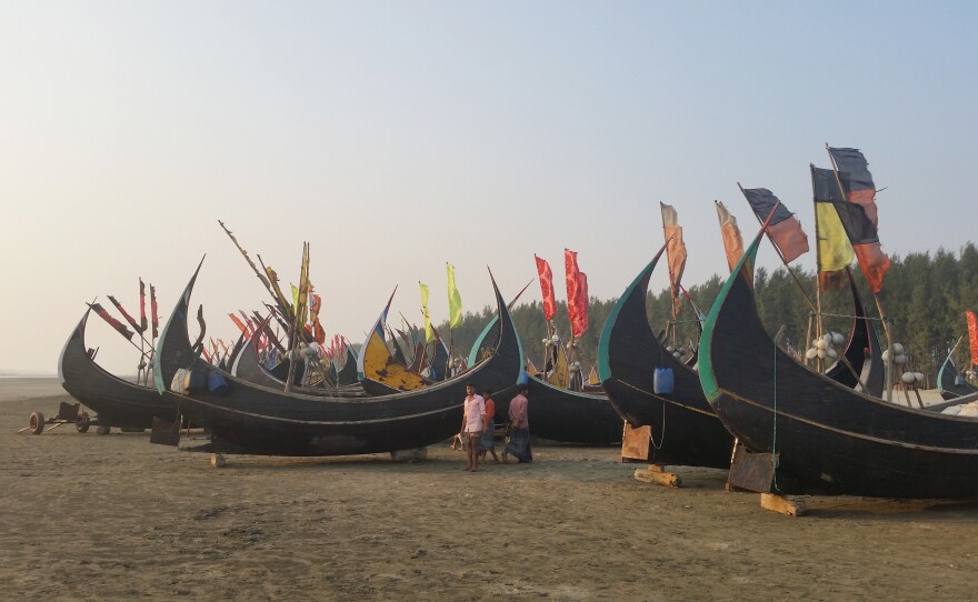 Fishing boats sit in the sunset on the beach in Teknaf in southern Bangladesh. Billed as the longest beach in the world, the Bangladeshi government has plans to turn the area into a tourist destination in hopes of bringing in badly needed jobs and investment.