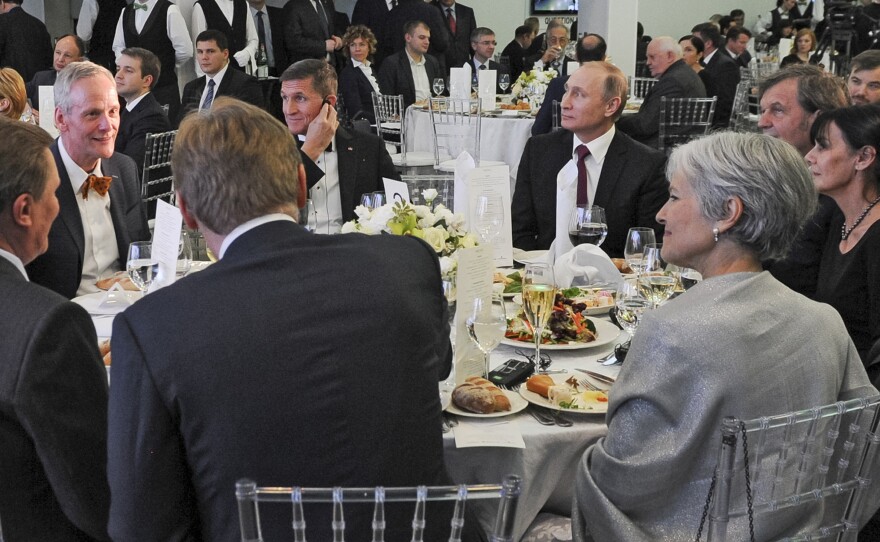Russian President Vladimir Putin (center right) sits next to retired U.S. Lt. Gen. Michael T. Flynn (center left), who later became President Trump's national security adviser, at a December 2015 dinner in Moscow.