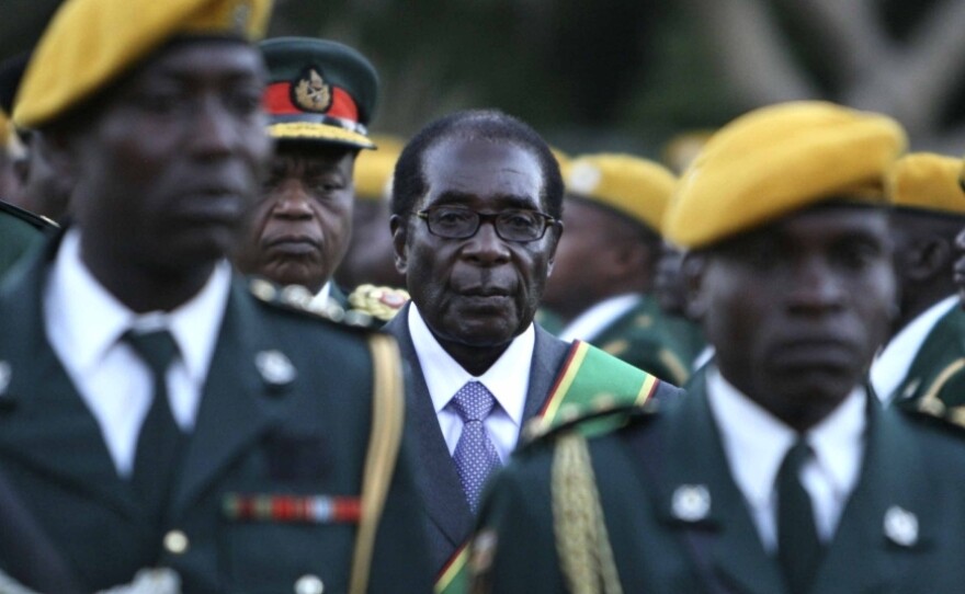 Zimbabwean President Robert Mugabe stands at his 2008 inauguration ceremony at the statehouse in Harare.