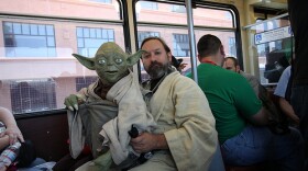 Obi-Wan and Yoda on the San Diego Trolley heading to Comic-Con International. 