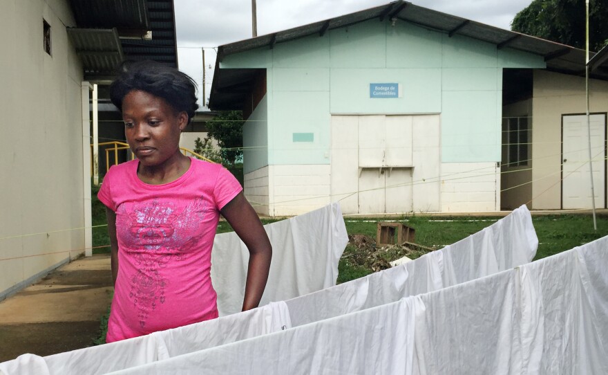 A migrant, who says she's from the Congo, hangs out laundry at a shelter in southern Costa Rica. In the past four months, more than 6,500 migrants have been registered entering Costa Rica along its southern border. Most say they are from Africa and Southeast Asia, but authorities believe the majority are from Haiti.