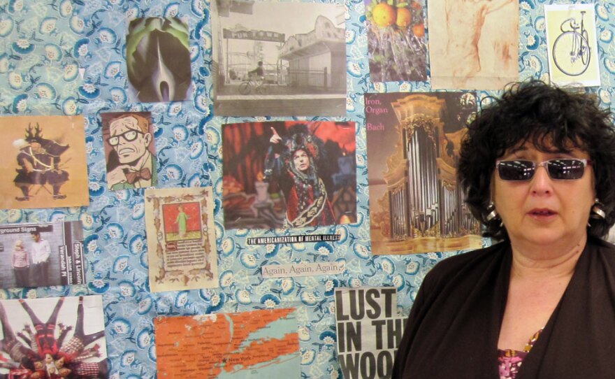 Brandi Scheiner, who was suspended when her principal accused her of incompetence, stands by the bulletin board in one of the rubber rooms.