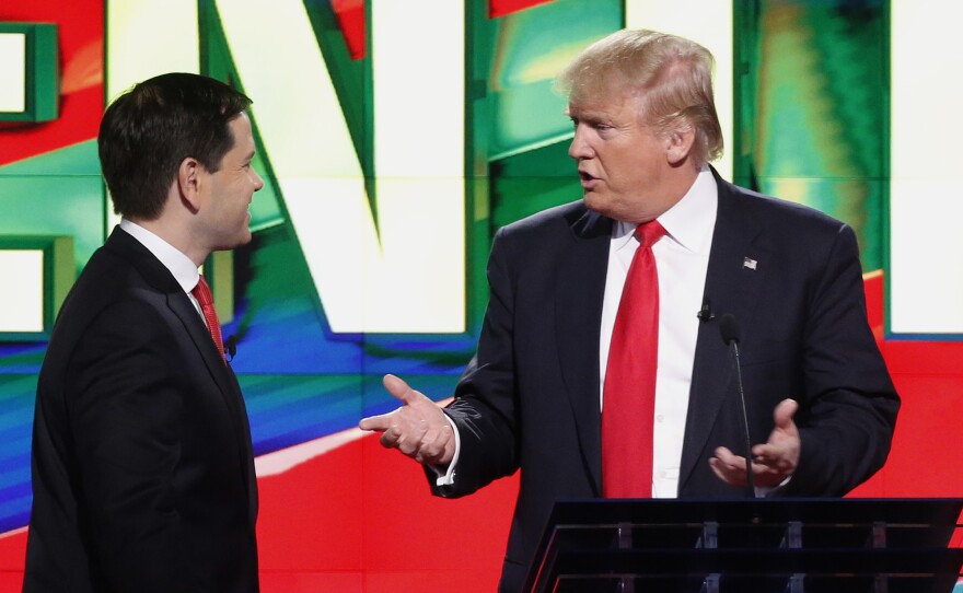 Sen. Marco Rubio, R-Fla., (left) and Donald Trump during a break in a Republican presidential debate in March.