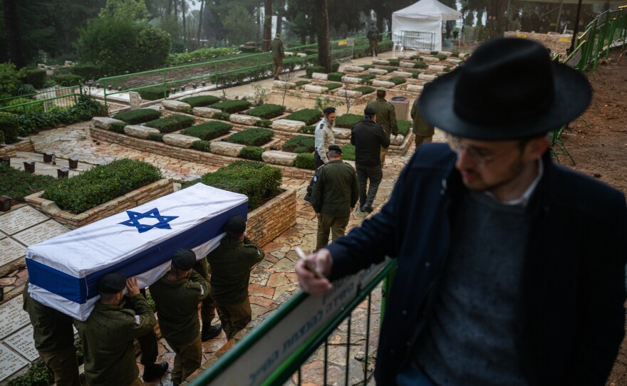 Israeli soldiers carry the casket of reservist Elkana Yehuda Sfez, who was killed in combat in Gaza, during his funeral at the Mount Herzl military cemetery in Jerusalem on Tuesday.