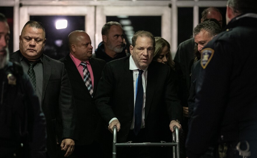 Harvey Weinstein (center) leaves a bail hearing last month in New York City. The former Hollywood megaproducer has been accused of sexual misconduct by dozens of women. He now faces five charges in New York City.