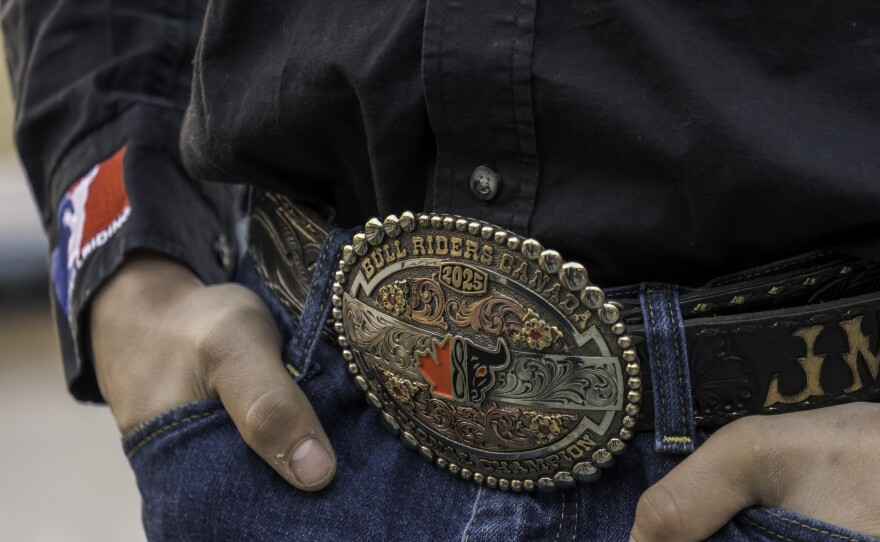 Bull rider Jeremy Maisonneuve wear a large belt buckle, marking a previous championship, Jan. 15, 2026.