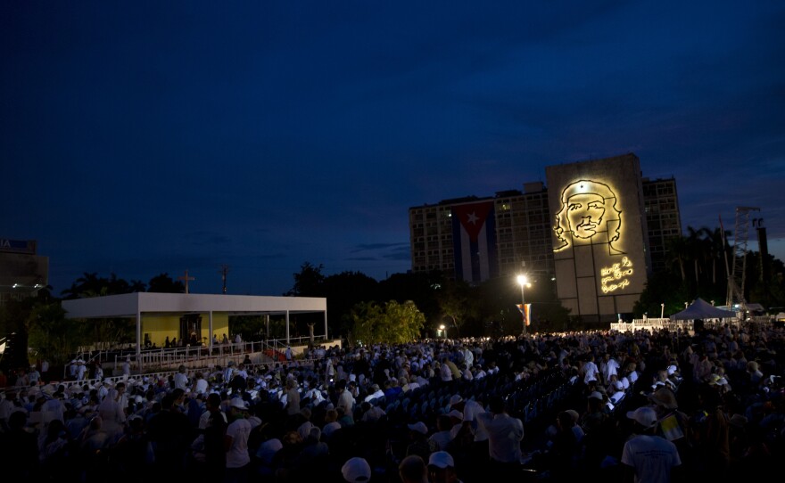 Faithful wait for the start of a Mass celebrated by Pope Francis in Revolution Square in Havana, Cuba, on Sunday.