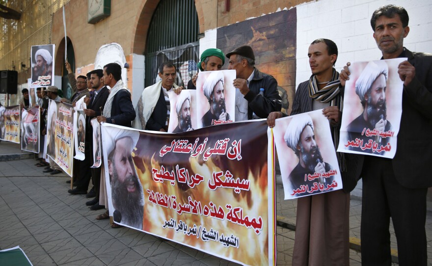 Shiite rebels hold posters of late Shiite cleric Nimr al-Nimr at a protest Thursday in Sanaa, Yemen. The cleric's execution by Saudi Arabia on Saturday sparked a dramatic deterioration in relations between Saudi and Iran.