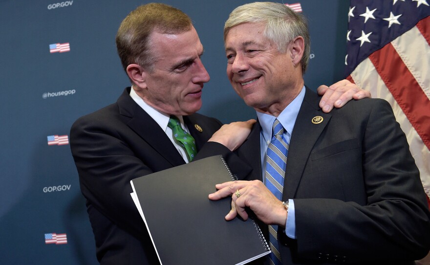 Rep. Tim Murphy, R-Pa., embraces Rep. Fred Upton, R-Mich., during a media briefing about the 21st Century Cures Act on Capitol Hill Wednesday.