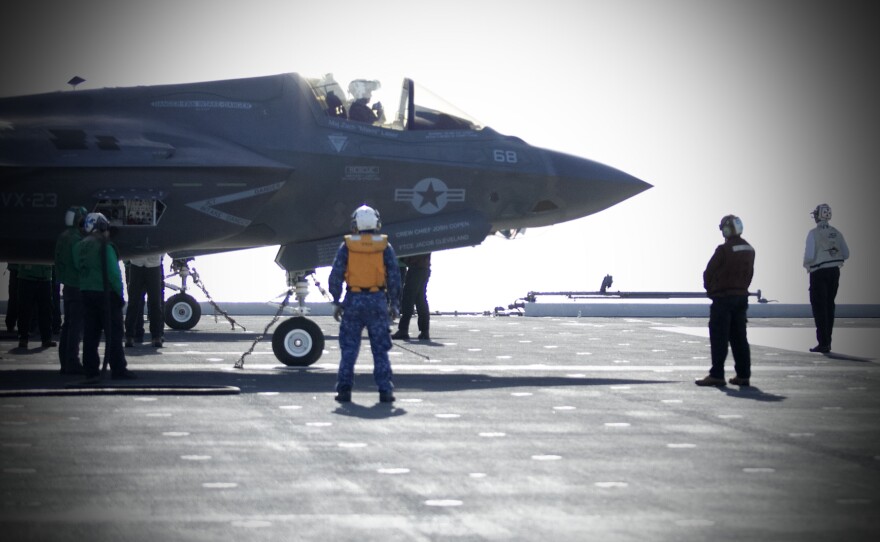 A plane captain communicates with the pilot of a F-35B before launch on Nov. 6, 2024 off the coast of San Diego, Calif.