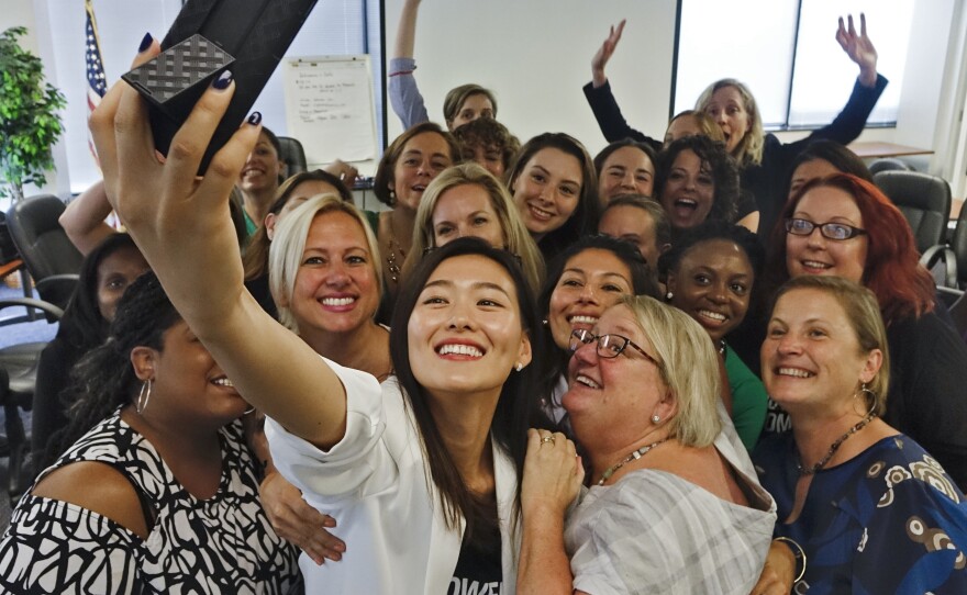 At the final session in a six-month political candidate training series called Emerge Virginia, Johanna Shin takes a group photo.