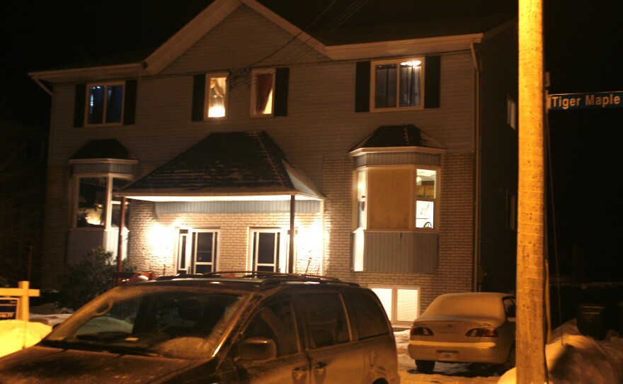 A duplex where a 19-year-old man was found dead is shown in Timberlea, Nova Scotia, on Friday. Royal Canadian Mounted Police say they foiled a plot to commit a mass shooting.