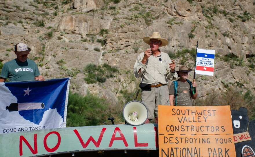 Retired wildlife biologist Raymond Skiles, who spent decades at Big Bend National Park, leads protesters in chanting "No Big Bend Wall."