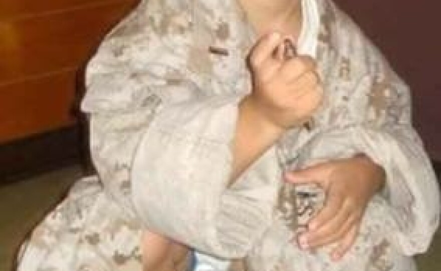 Sebastian, when he was just 3 years old, wearing his father's fatigues in 2008.