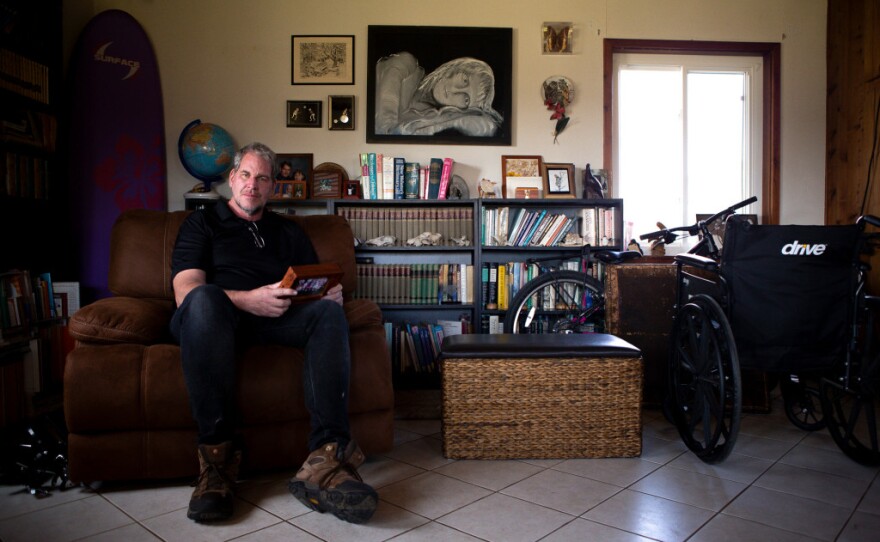 Andrew Simmons sits for a portrait in the family room of his Ramona home on Jan. 30, 2020. Photo by Lisa Hornak for CalMatters.