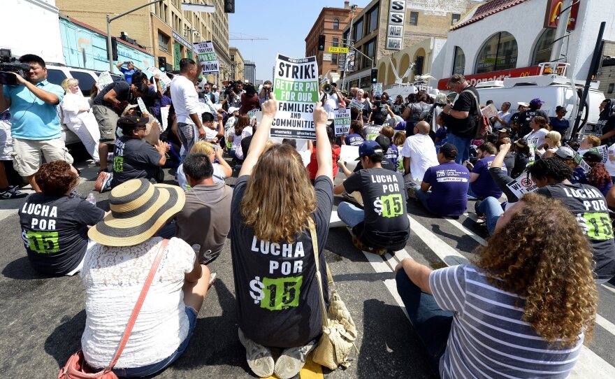 Protesters assemble in front of a McDonald's in Los Angeles, demanding a $15 an hour minimum wage in September.