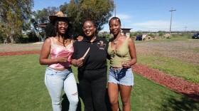 Jazzay Buncom, Diamond Brandon and Lucie Cishugi (left to right) hold red burgundy okra and black-eyed pea seeds at S&S Friendly Ranch on Feb. 27, 2026.