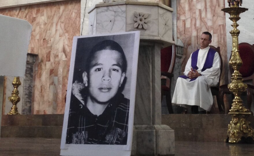 A photo of Jose Antonio Elena Rodriguez, who was fatally shot by a U.S. Border Patrol  near the Mexico-U.S border, rests on a church altar during a memorial mass in Nogales, Sonora, Mexico. A federal appeals court heard arguments on whether his family can file a civil lawsuit in U.S. courts.
