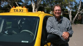 Yellow Cab driver John Bowen is pictured beside his cab in North San Diego County in this undated photo.