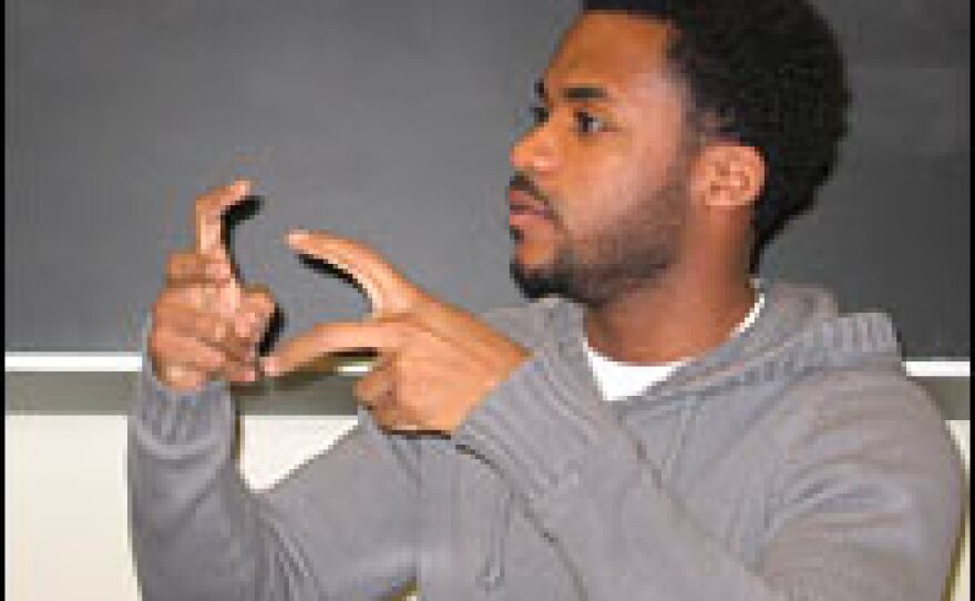 Demond Mullins, attending a sociology class at the City University of New York, says academics are helping him cope with the effects of war.