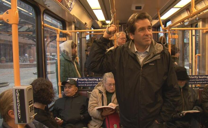 Host and reporter Miles O’Brien travels from city to city, interviewing residents and policy makers caught up in the process of re-imagining their communities. Here, he rides light rail in Portland, Oregon. (Blueprint America: Road to the Future)