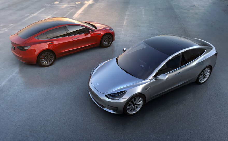 The Model 3 has "fast charging" capability, a trunk in the front and the rear and a sheet-glass roof.