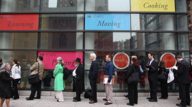 People stand in a line that stretched around the block to enter a job fair held at the Jewish Community Center (JCC), on March 21, 2012 in New York City.