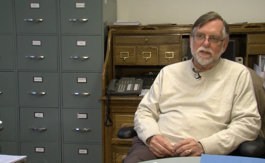 Catholic Charities Executive Director Robert Moser discusses refugee resettlement from his office, Feb. 17, 2017.