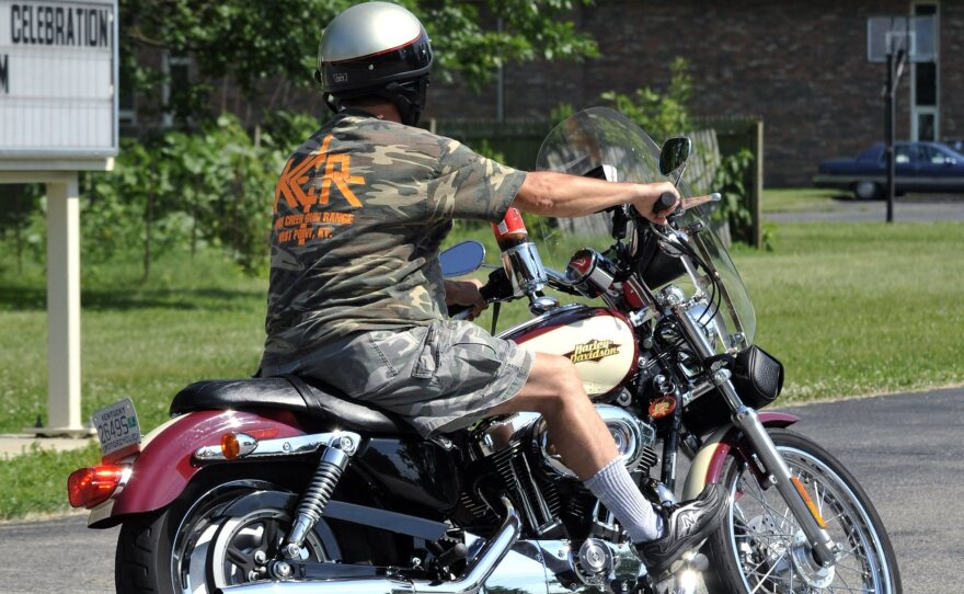 As of Wednesday, Kentucky has made it legal for people on motorcycles to run red lights after waiting for them to change. A motorcyclist rides in Kentucky in this file photo.