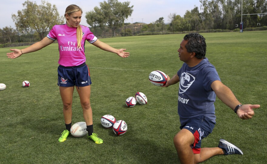 Richelle Stephens works on a move with head coach Richie Walker.