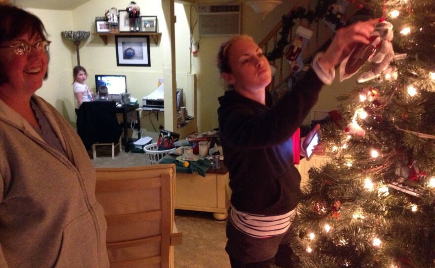 After Sandy, the Hardys' goal was to get their house together enough to have a normal Christmas. The ornaments survived the storm. Shown here, from left, are Linda Hardy, her granddaughter Annie and her daughter Heather.