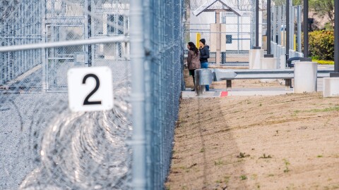 County Supervisors Terra Lawson-Remer and Paloma Aguirre speak through the fence after being denied for a pre-approved inspection at the CoreCivic Detention facility in Otay Mesa, Feb. 20, 2026.