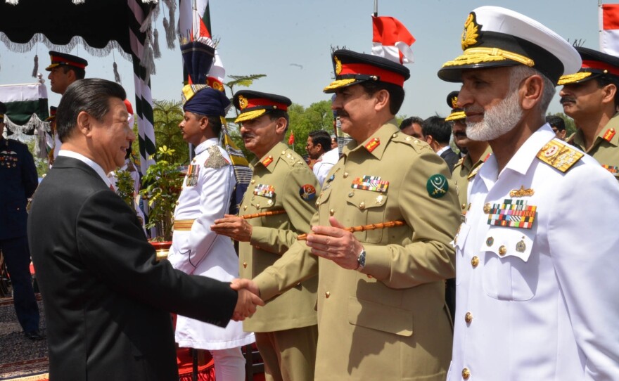 China's President Xi Jinping (left) greets Pakistan's army chief Gen. Raheel Sharif in Islamabad, Pakistan, on April 20. During Xi's visit, the two sides launched an ambitious $46 billion economic corridor linking Pakistan's port of Gwadar with western China.