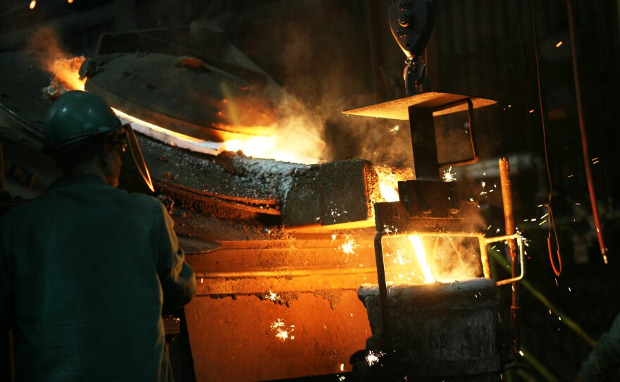 Ryan Houseman is at the controls of the "teapot" furnace spout as it loads the ladle.