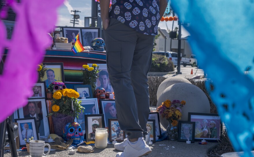 A visitor approaches the ofrenda on Wednesday, Nov. 1, 2023.