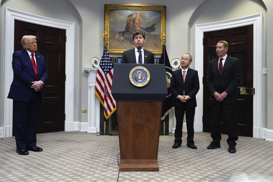 Sam Altman, OpenAI CEO, speaks as President Donald Trump, left, Masayoshi Son, SoftBank Group CEO, third from left, and, Larry Ellison, chairman of Oracle Corporation and chief technology officer, right, listen, in the Roosevelt Room at the White House, Tuesday, Jan. 21, 2025, in Washington.