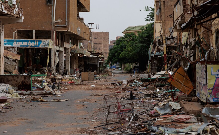 A street running through the Souq Omdurman market is strewn with debris from fighting, in Omdurman, Sudan, on Sept. 7.