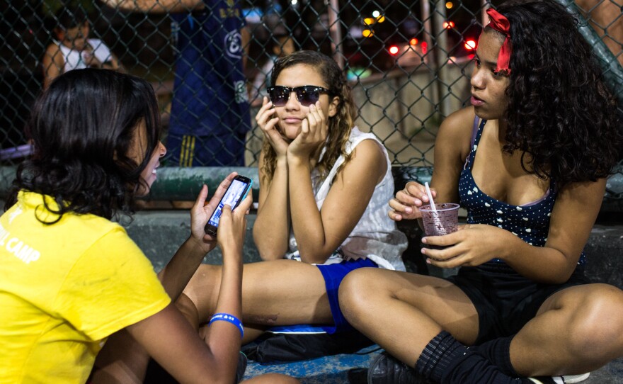 Lala, center, and Milena, left, would like to see more incentives for young girls to take up soccer.