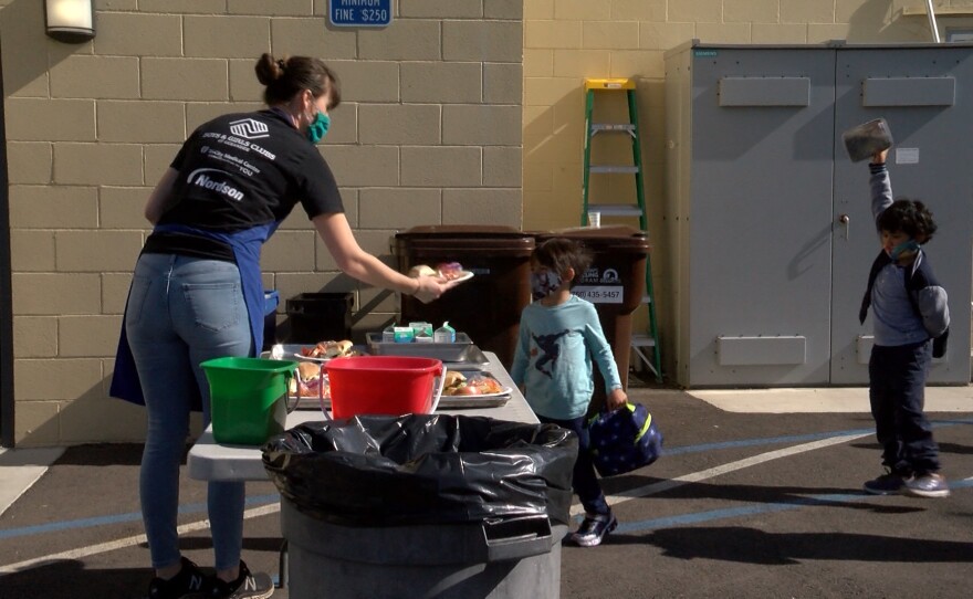 Children receiving lunch from staff at the Boys and Girls Club in Oceanside. November 18, 2020. 