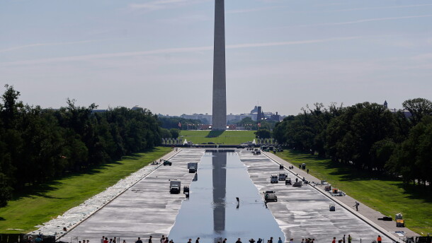 Workers refill the Lincoln Memorial Reflecting Pool on Friday, after a weeks-long project to resurface and repaint the basin.
