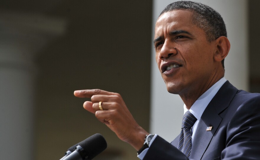 President Obama speaks in the Rose Garden at the White House on Monday. Obama laid out a plan for trillions in deficit cuts but warned Republicans he will veto any bill that makes structural changes to Medicare unless they agree to additional revenues.