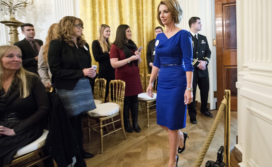 Shannon Watts, founder of Moms Demand Action for Gun Sense in America, arrives in the East Room of the White House on Jan. 5 to hear President Obama speak about steps his administration is taking to reduce gun violence.