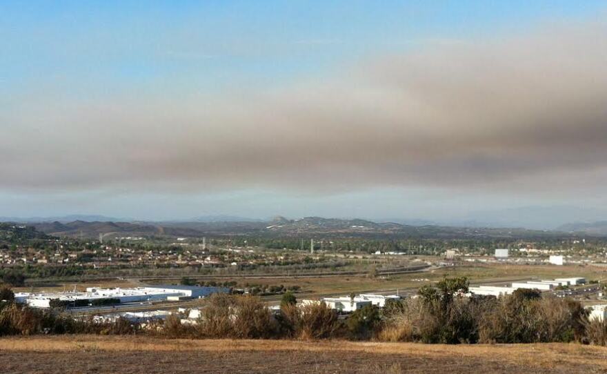 Smoke spreads as a fire burns at Camp Pendleton, Aug. 13, 2015.
