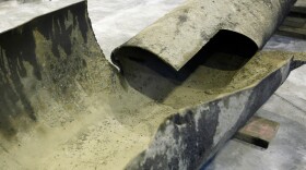 A piece of the ruptured pipeline from last month's fatal accident in San Bruno, Calif., displayed in a laboratory at the National Transportation Safety Board's training center in Ashburn, Va. A preliminary NTSB report says a power failure led to a brief change in pipeline pressure but does not say that the pressure change caused the blast that killed eight people and destroyed 37 homes.