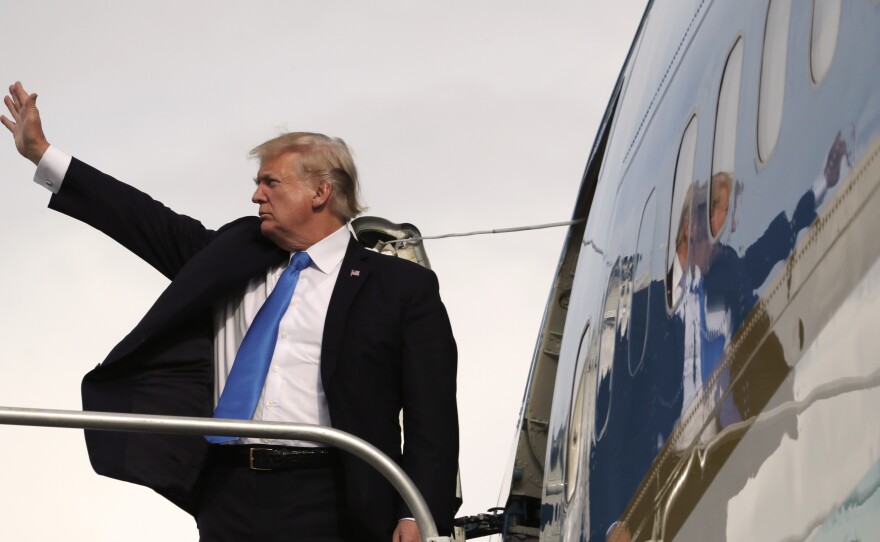 President Trump paid an impromptu call on reporters and staffers before leaving for Davos to say how eagerly he looks forward to talking with special counsel Robert Mueller.