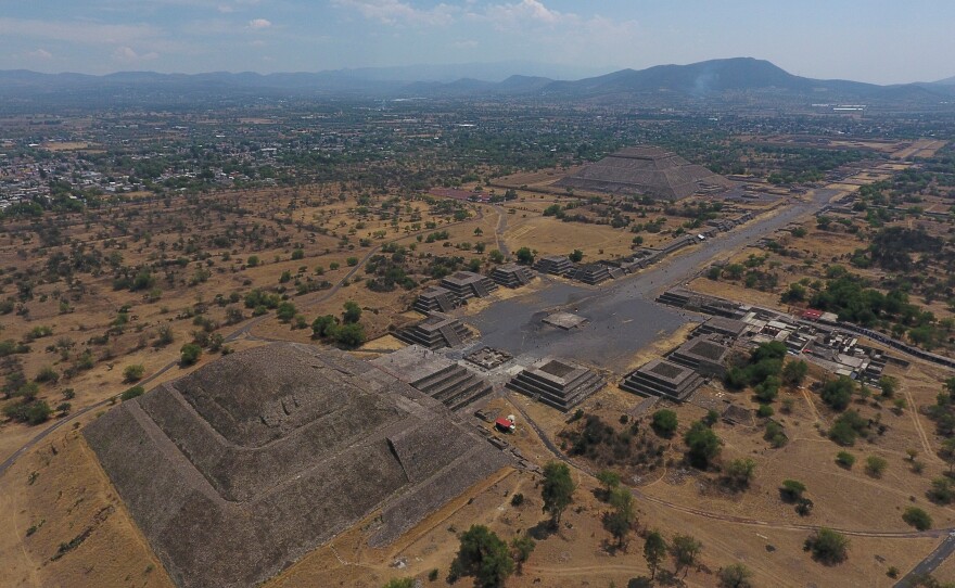 The Pyramid of the Moon, left, and the Pyramid of the Sun, back right, are seen along with smaller structures lining the Avenue of the Dead, in Teotihuacan, Mexico, March 19, 2020.