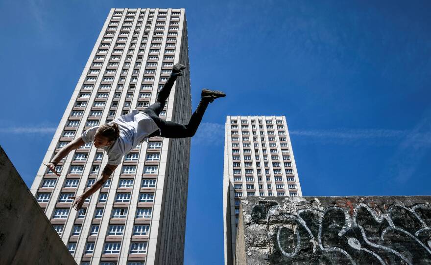 Many in the parkour community are resisting attempts by the International Gymnastics Federation to bring the sport under its umbrella. Here, Johan Tonnoir practices parkour in Paris in May.