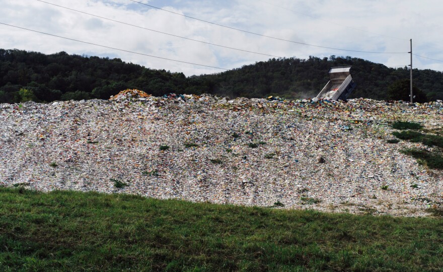 A truck dumps broken and discarded pieces of ceramic onto what employees call "Sparkle Mountain," located on the property of the Homer Laughlin China Co. Some of the debris gets recycled.