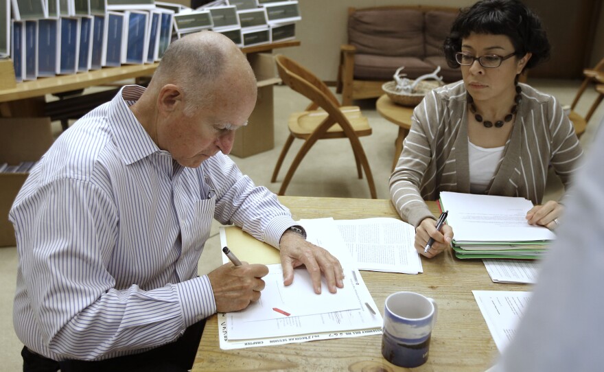 California Gov. Jerry Brown signs one of the hundreds of bills on Friday, among them a new law that is contains the most stringent digital privacy protections in the country.