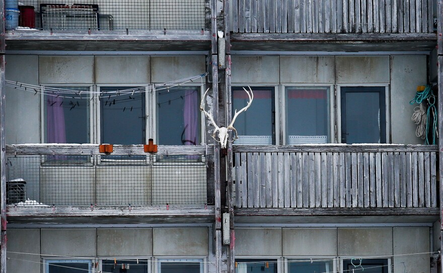 A reindeer skull ornaments a Nuuk apartment block.